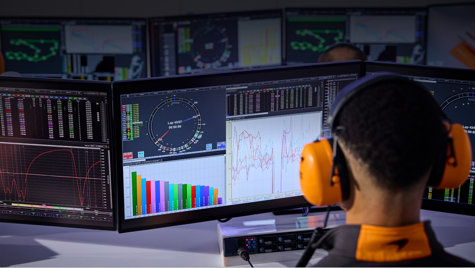A McLaren Race Engineer views telemetry data on a computer screen at the McLaren Technology Centre.