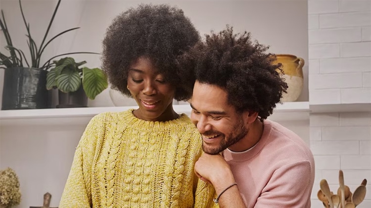 Two people prepare food in a kitchen